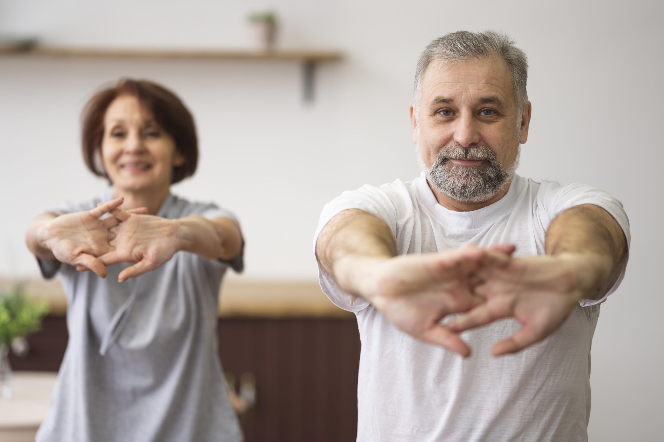 medium-shot-adults-stretching-indoors